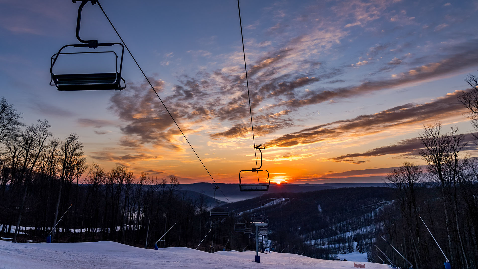 Setting sun on the ski slopes at Holiday Valley Resort