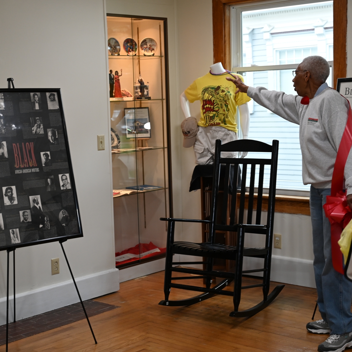 Della explaining an exhibit at the Center