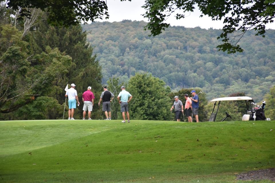 Golfers on the course at Elkdale Country Club