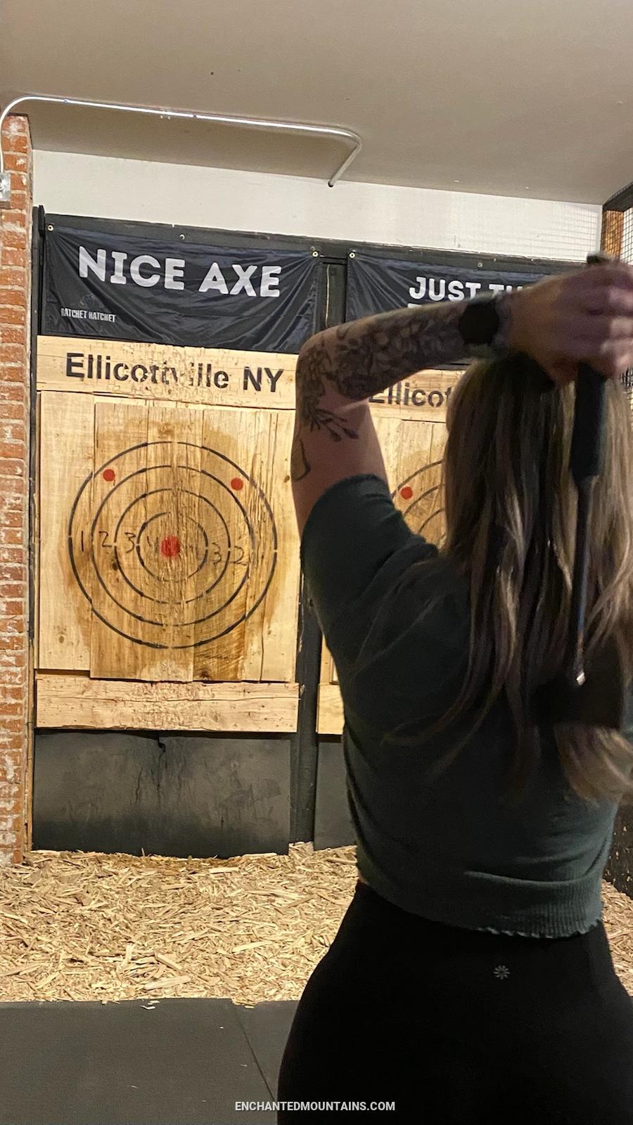 Woman throwing an axe at Ratchet Hatchet