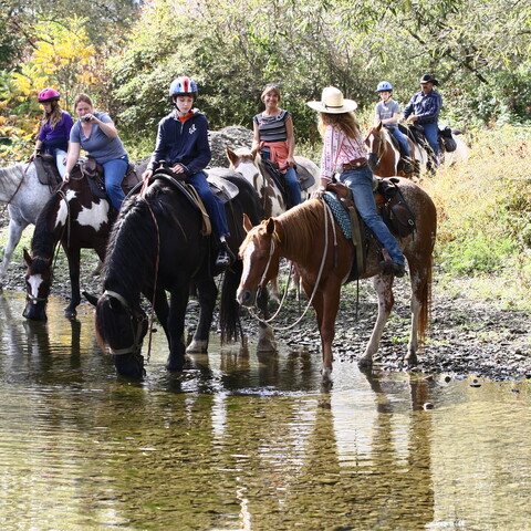 Family going horseback riding with guides from The CrossPatch