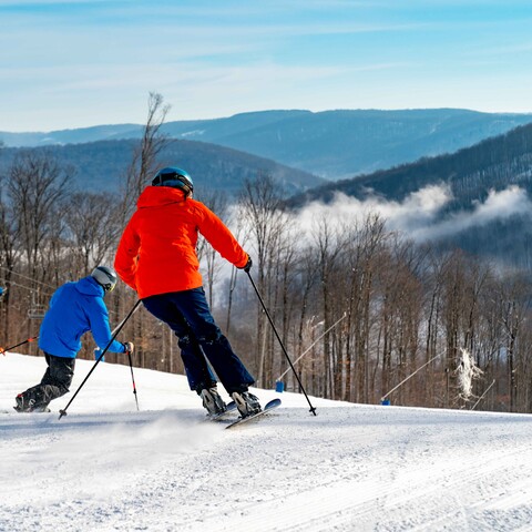 Skiers coming down the hill at Holiday Valley Resort